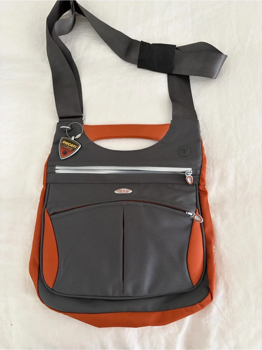 TUMI Ducati Crossbody messenger bag. Discreet corporate logo on back. Never used